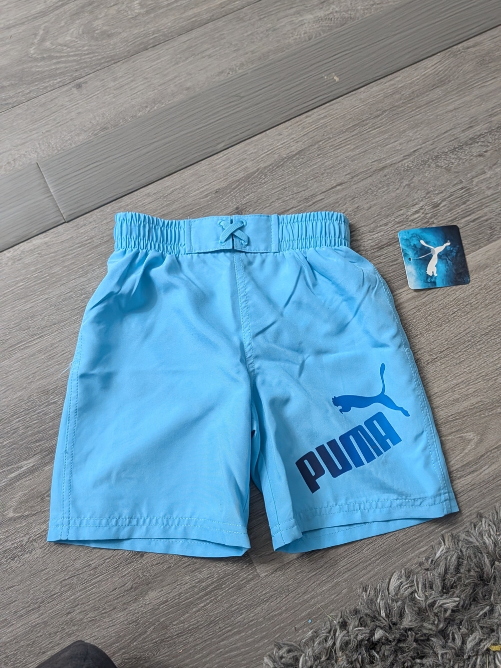 Puma Kids Light Blue Swim Trunks with Dark Blue Logo